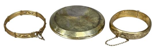 ROLLED GOLD HINGED BANGLE, with engraved decoration to one half; a yellow metal hinged bangle; and a