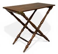 MAHOGANY FOLDING CAMPAIGN-TYPE TABLE, circa 1900, with turned supports and brass hinges, 70 (h) x 88