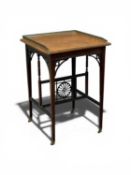 EDWARDIAN MAHOGANY DECORATIVE SIDE TABLE, with galleried top, elegant stretcher, on brass castors,