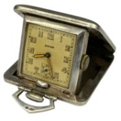 EROS SQUARE SILVER TRAVEL PURSE WATCH, London import marks, folding and engraved cushion case,
