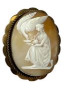 9CT GOLD FRAMED OVAL CAMEO BROOCH, carved with a maiden feeding a swan, 56 x 48mms, 17.5g gross