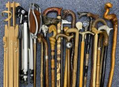 LARGE COLLECTION OF WALKING STICKS, some having ornate figural handles etc. Provenance: private