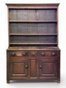 EARLY 19TH CENTURY OAK WELSH DRESSER of small proportions, with three-shelf rack, three drawers over
