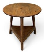 PINE CRICKET TABLE, with base shelf, 75 (h) x 75cms (diam.) Provenance: private collection Ynys Môn