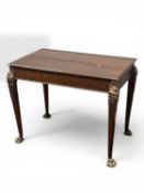 IRISH MAHOGANY CENTRE TABLE having a rectangular top, slight cabriole supports with lion's mask