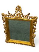 RECTANGULAR GILT FRAMED WALL MIRROR with pierced and carved foliate frame, bevelled plate, 98 (h)