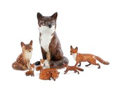 GROUP OF BESWICK FOXES, including seated fireside model #2348, two medium sized figures, standing