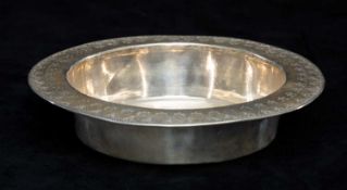 LIBERTY & CO. GEORGE V CIRCULAR SILVER BOWL having a broad rim with engraved geometric design,