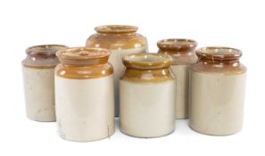 SIX TWO-TONE STONEWARE STORAGE JARS, late 19th century, one with cover, 26cms (h) the taller