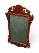 MAHOGANY FRET-FRAMED WALL MIRROR, 72 (h) x 42cms (w) Provenance: private collection Merseyside