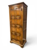 QUALITY REPRODUCTION OAK HALL WARDROBE being fitted with a single panelled door opening to a shelf