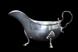 EDWARDIAN SILVER SAUCEBOAT with scroll loop handle, on three shell-capped hoof feet, Atkin Brothers,