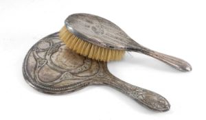 SILVER-BACKED HAND MIRROR, with Art Nouveau style embossed decoration; and a silver-backed hand