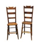 PAIR OF ARTS & CRAFTS PERIOD MAHOGANY 'CORRECTIONAL' CHAIRS with ladder backs, solid seats, turned