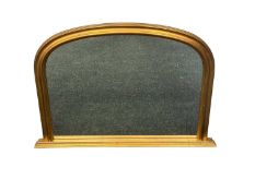 CONTEMPORARY GILT-FRAMED OVERMANTEL MIRROR with arched top, 76 (h) x 107cms (w) Provenance: