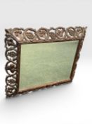 VICTORIAN WOOD-FRAMED RECTANGULAR WALL MIRROR with outer frame heavily carved and pierced as