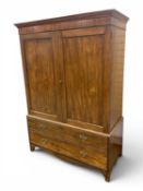 19TH CENTURY MAHOGANY LINEN PRESS with hanging space over a base fitted with two long drawers,