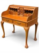 WALNUT OPEN BUREAU in the antique style, fitted with pigeonholes and secret drawers, raised on