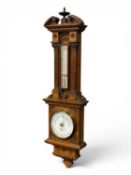 NEGRETTI & ZAMBRA OF LONDON, CARVED OAK-CASED ANEROID BAROMETER with thermometer, 76cms (h)