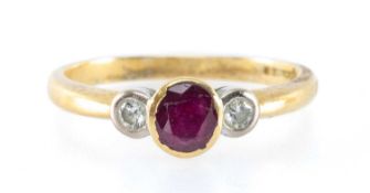 RUBY & DIAMOND RING, in 18ct gold, central oval ruby with diamond to either side, ruby 0.55ct,
