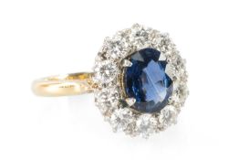 SAPPHIRE & DIAMOND CLUSTER RING, oval-cut sapphire approx. 8 x 7mm, within a halo of ten brilliant-