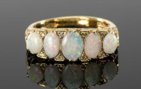 OPAL & DIAMOND CLUSTER RING, in 18ct gold, five opals dispersed with tiny diamond chips, in scroll