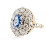 18CT GOLD SAPPHIRE & DIAMOND CLUSTER RING, the oval mixed-cut sapphire (9 x 6mms approx.) within