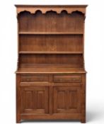 20TH CENTURY OAK WELSH DRESSER, shaped rack with two shelves over two drawers and two doors, 202 (h)