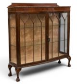 FINE EDWARDIAN MAHOGANY BOWFRONT CHINA CABINET, with twin glazed doors, rail back, on ball and