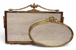 TWO GILT-FRAMED WALL MIRRORS, oval with leaf capped surmount, 52 x 73cms; and rectangular with urn