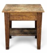 PRIMITIVE WOODEN WORK TABLE OR BUTCHER'S BLOCK having lower shelf, 94 (h) x 91 (w) x 65.5cms (d)