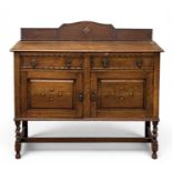 EDWARDIAN OAK RAIL BACK SIDEBOARD, with two doors and two drawers, on twist supports, 109 (h) x