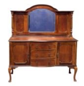 EDWARDIAN MIRROR-BACK SIDEBOARD having a dome mirrored back, bow-front base, three drawers, two