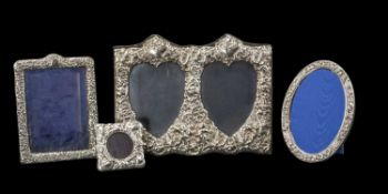 FOUR EMBOSSED SILVER PHOTOGRAPH FRAMES comprising double part photo frame, London 1989, 25.5cms (h),