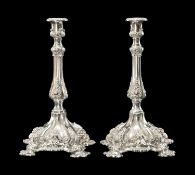 MODERN PAIR OF CONTINENTAL SILVER CANDLESTICKS, import marks for London 1992, in the 18th century