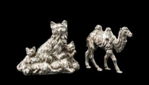 TWO NOVELTY SILVER ANIMALS family of cats stamped 925, 9cms (w) and a striding camel, 7cms (w), both