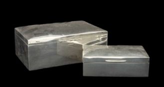 TWO SILVER CIGARETTE BOXES the larger of plain form with monogrammed engraved lid, Sheffield 1907,