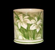 LLANELLY POTTERY JAR painted with pair of daffodils in pale green moulded and line painted base,