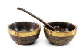PAIR OF WELSH TURNED BEECH CAWL BOWLS & LADLE early 19th century, with brass strap rims fixed by