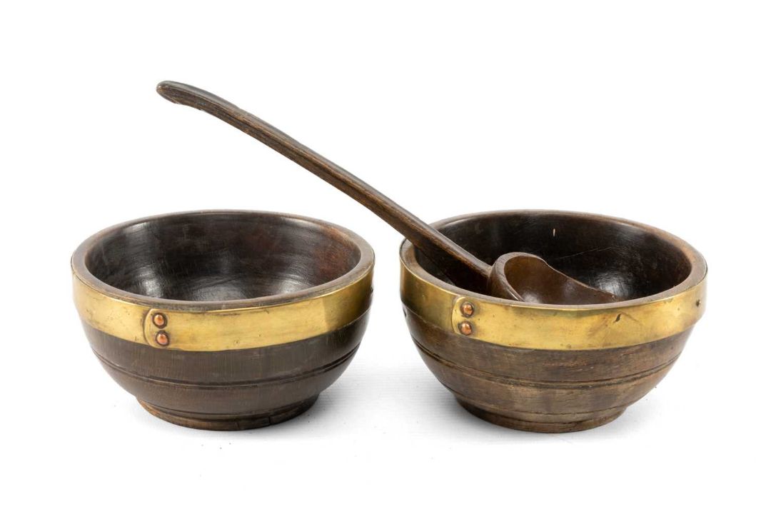 PAIR OF WELSH TURNED BEECH CAWL BOWLS & LADLE early 19th century, with brass strap rims fixed by