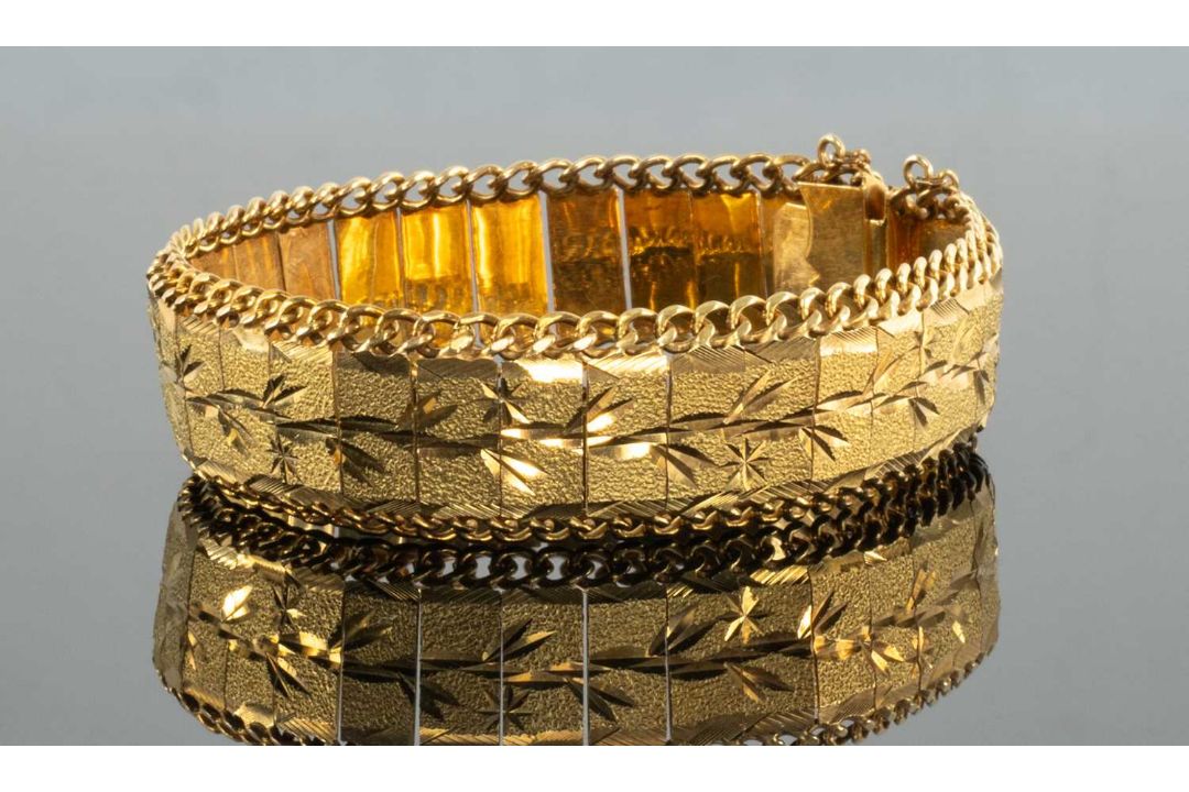 YELLOW METAL BRACELET, matt finish, engraved with floral motifs, clip-type closure with hook and