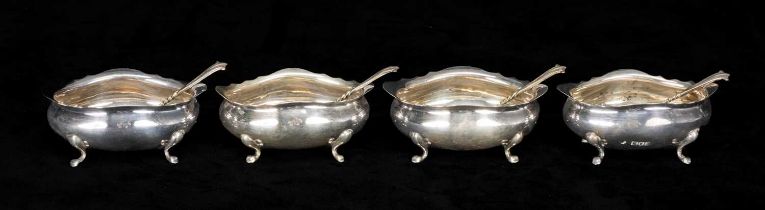 SET OF FOUR EDWARD VII OVAL SILVER OPEN SALTS, each on four pad feet, Holland Aldwinckle & Slater,