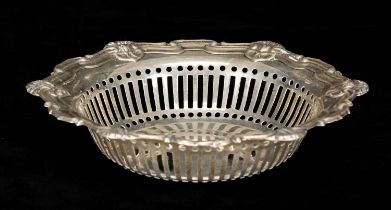 EDWARDIAN CIRCULAR SILVER BON BON DISH, the rim moulded and with shell motifs, pierced sides,