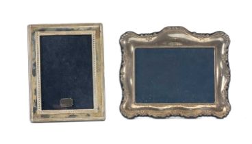 TWO MODERN SILVER PHOTOGRAPH FRAMES by Carrs of Sheffield, shaped design with moulded detail, 16 x