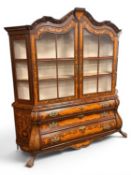 DUTCH WALNUT & FLORAL MARQUETRY BOMBE CABINET, 19th century, the top with glazed doors opening to