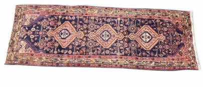 NORTH-WEST PERSIAN BLUE GROUND WOOLLEN RUNNER, 310 x 104cms Provenance: private collection