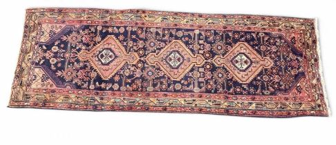 NORTH-WEST PERSIAN BLUE GROUND WOOLLEN RUNNER, 310 x 104cms Provenance: private collection