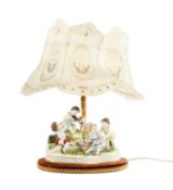 CAPODIMONTE PORCELAIN FIGURE GROUP, young children with musical instruments or playing, mounted on a