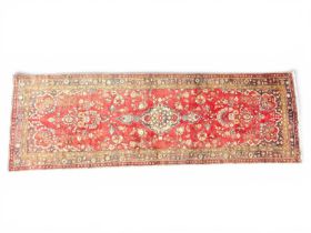 SAROUQ RED GROUND WOOLLEN RUNNER, 310 x 103cms Provenance: private collection Flintshire