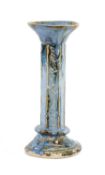 STUDIO POTTERY CANDLEHOLDER, blue flambé drip glazed and with curled tail design to base, 26cms (
